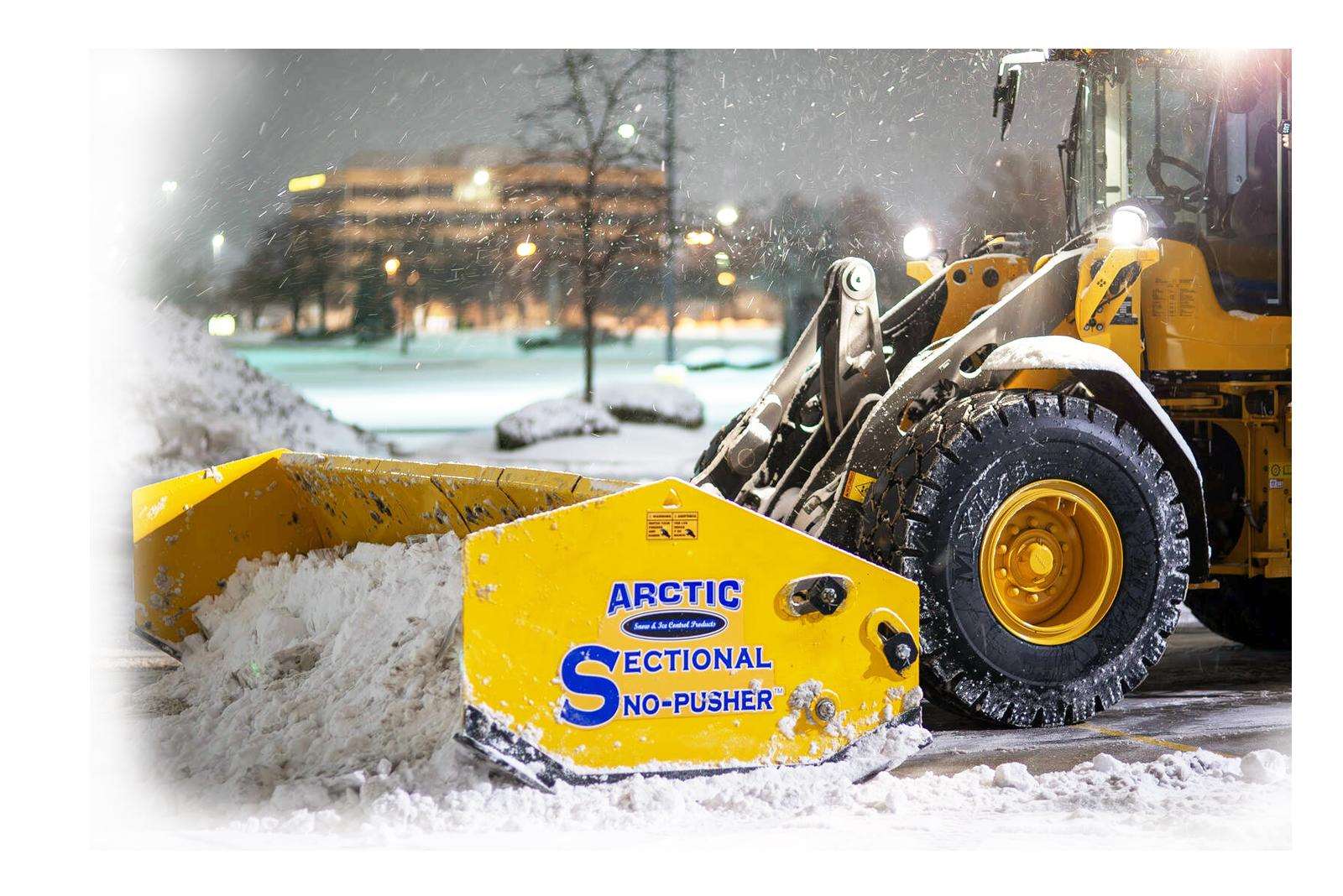 Arctic sectional Sno-Pusher clearing snow